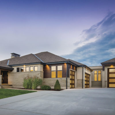 modern wood garage door with lots of glass by clopay