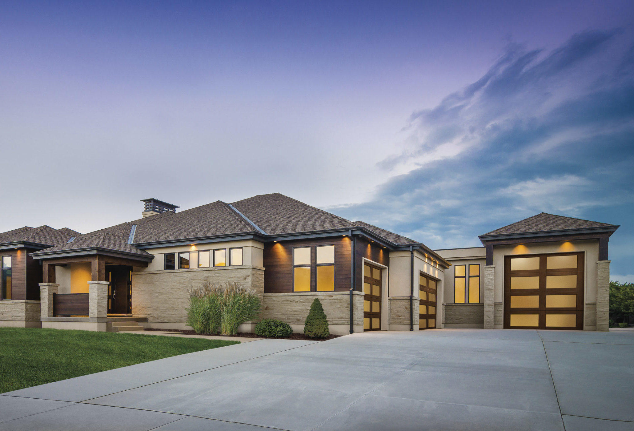 modern wood garage door with lots of glass by clopay