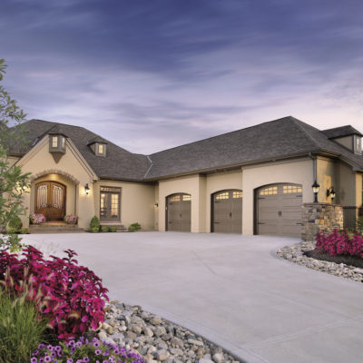 arched brown garage doors in steel by clopay