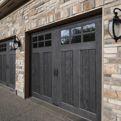 grey or black faux wood garage doors with windows by clopay