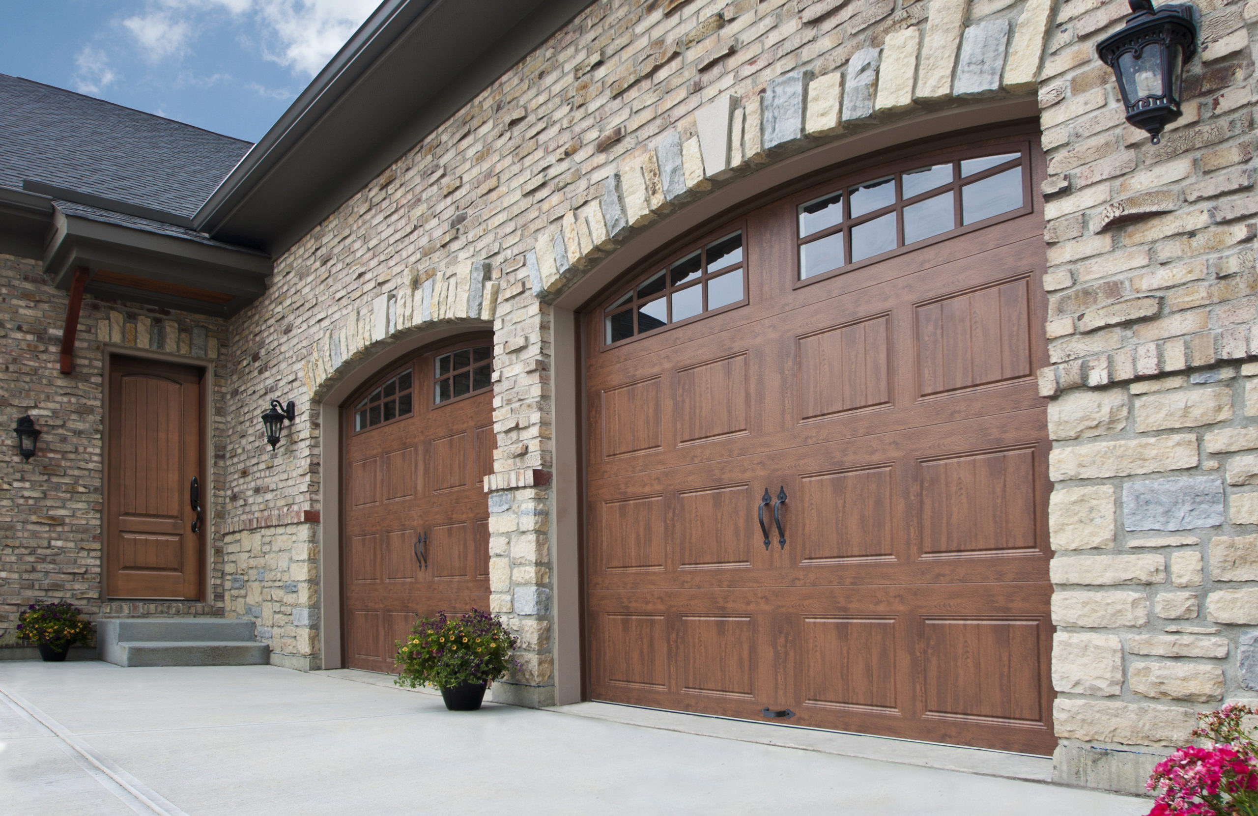 rustic steel arched garage doors by clopay