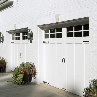 three single car garage doors in white with windows