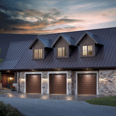 three single car garage doors with wood grain panels and windows by clopay