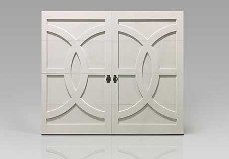 traditional white wood garage door by clopay