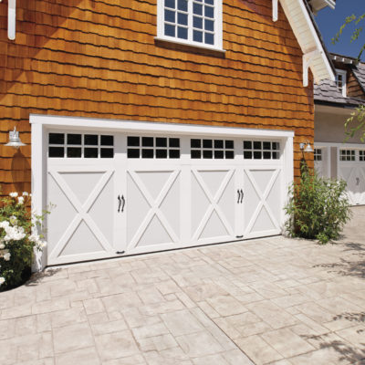 white decorative garage door with x and windows by clopay