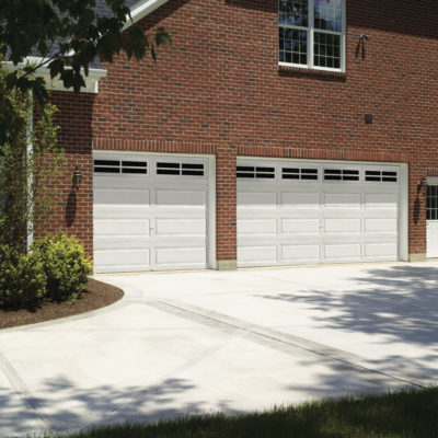 white garage door with oversized panels and rectangular windows by clopay
