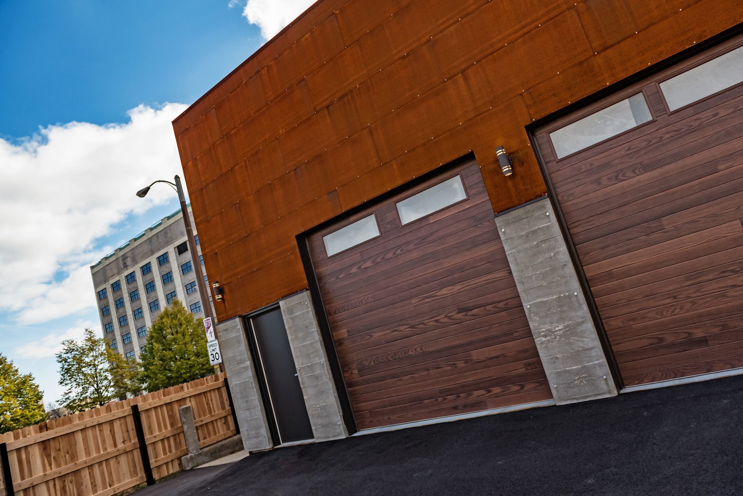 chi overhead wood planks garage door with two windows