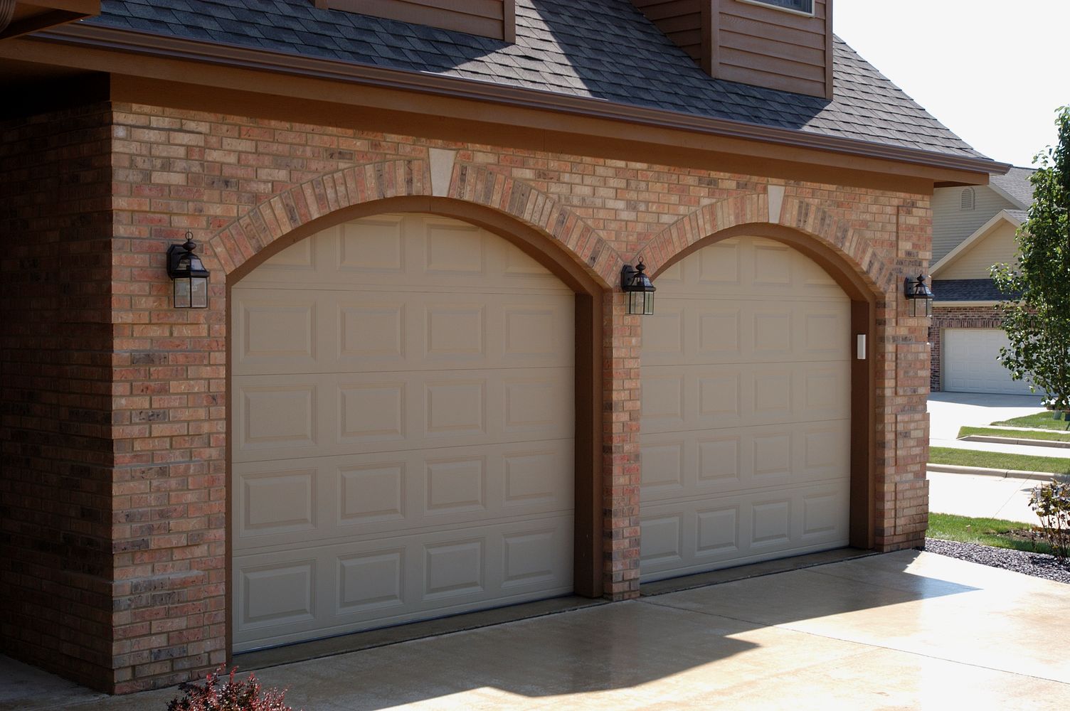 eyebrow one car garage doors in tan by chi ohd