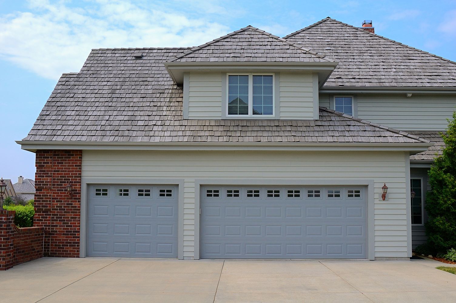 light blue two car and one car garage door in steel by chi ohd