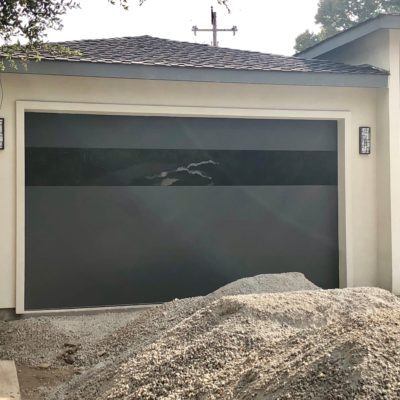 modern matte black garage door with black glass