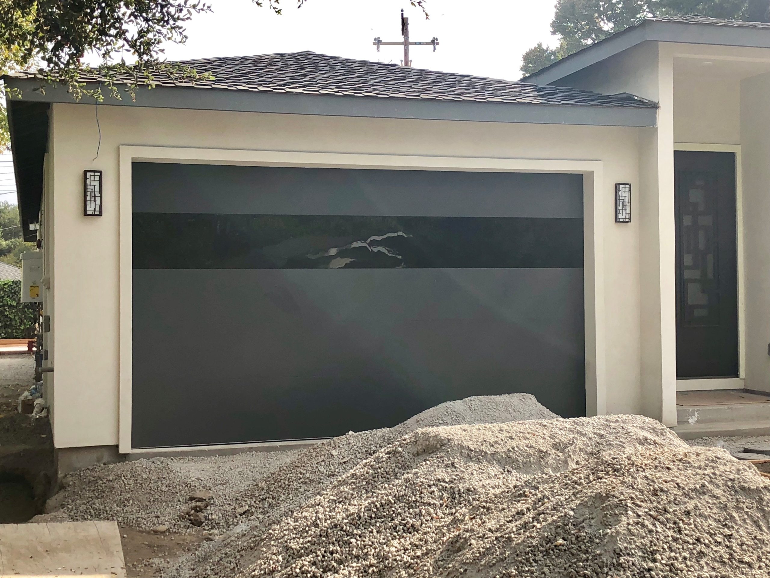 modern matte black garage door with black glass