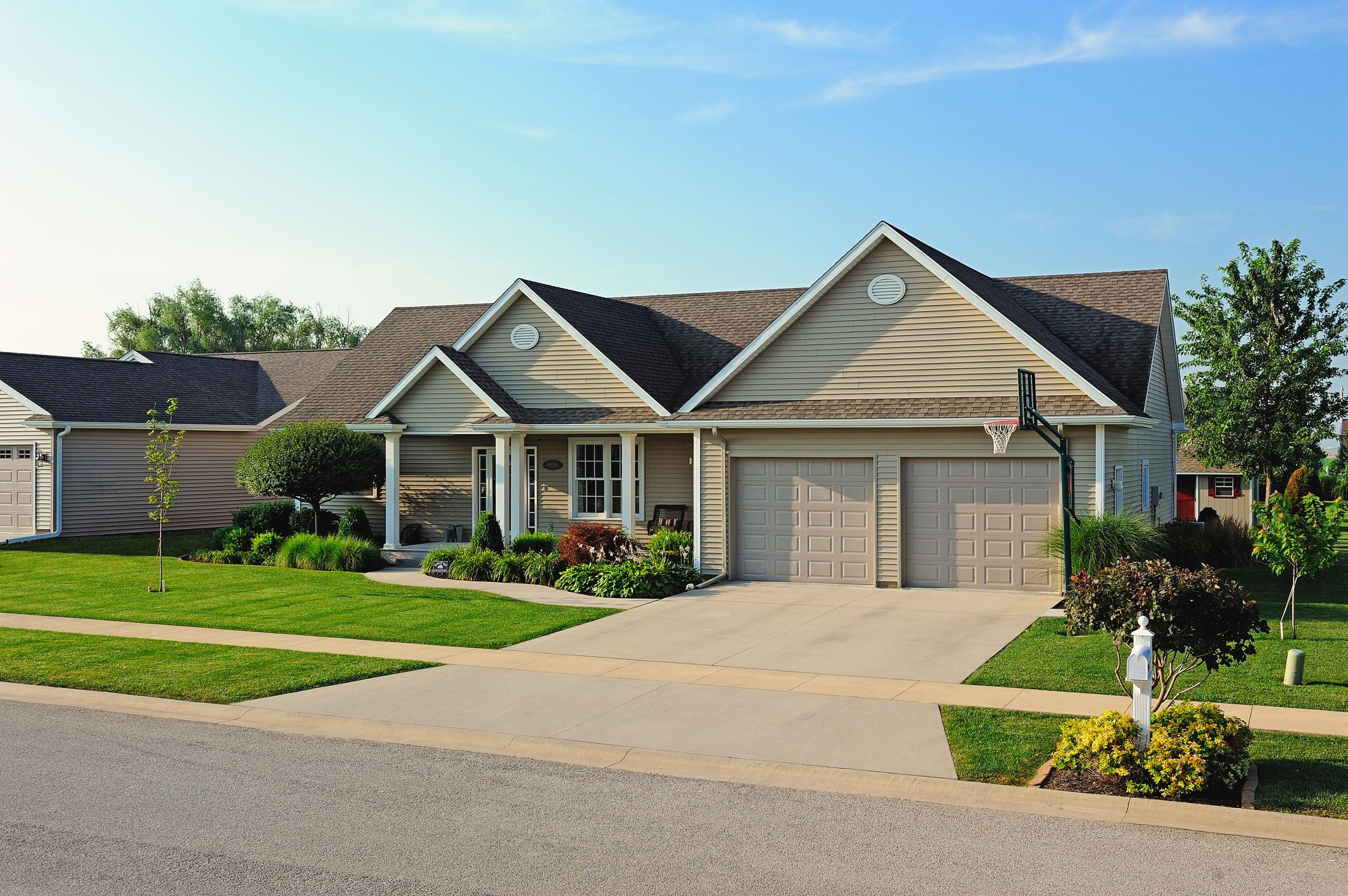 one car garage doors side by side in tan by chi ohd