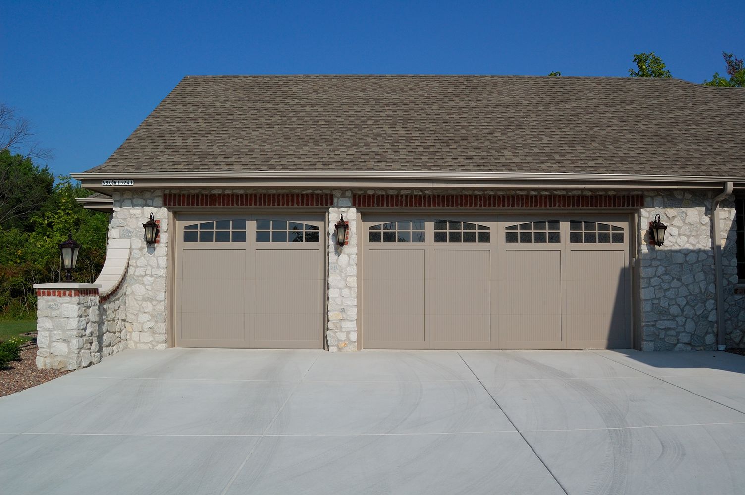 tan single and two car garage doors with arched windows by chi ohd