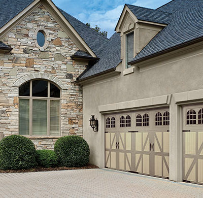 tudor style two tone steel garage door by amarr