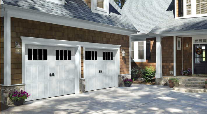 white farmhouse style garage door with windows by amarr