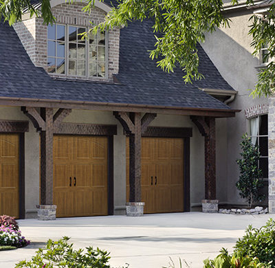 yellow wood carriage style garage door by amarr