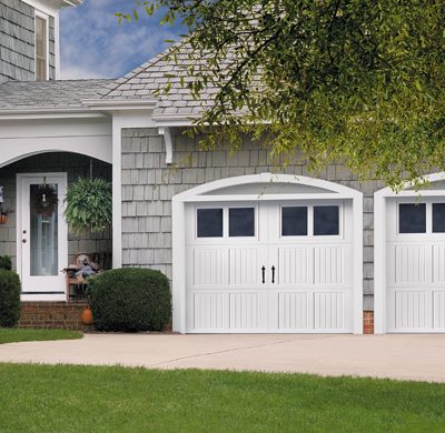 white bead board style steel garage door with rectangular windows by amarr