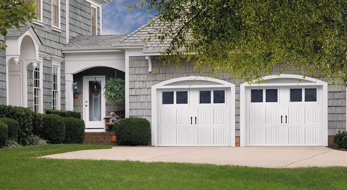 white bead board style steel garage door with rectangular windows by amarr