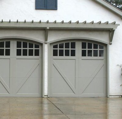 one car eyebrow garage door with windows