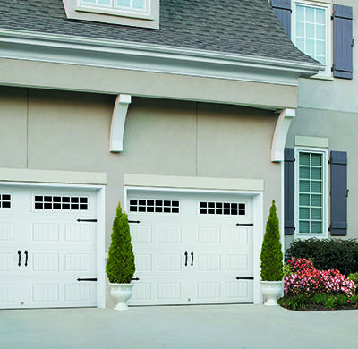white steel carriage style garage doors by amarr