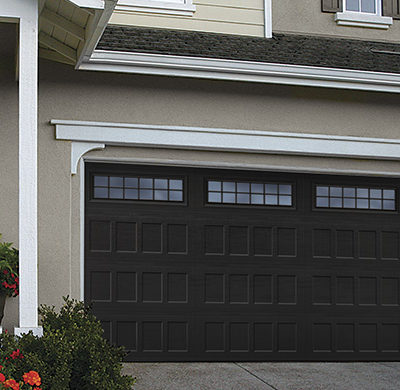 black two car steel garage door with windows and grids by amarr