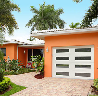 traditional steel garage door with modern windows by amarr