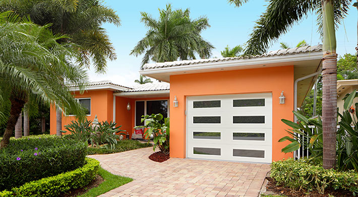 traditional steel garage door with modern windows by amarr