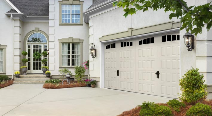 two car tan steel carriage house garage door by amarr