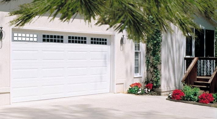traditional style steel garage door with windows by amarr