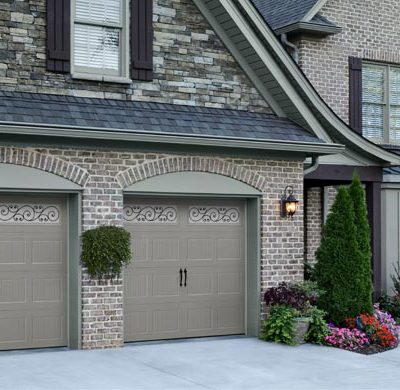 dark taupe single car garage door with iron in the windows