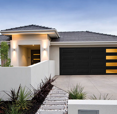 dark long panel garage door with windows by amarr