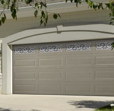taupe garage door with wrought iron windows by amarr