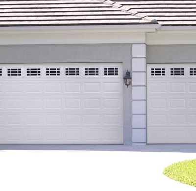 two car and one car garage door in steel white with windows by amarr