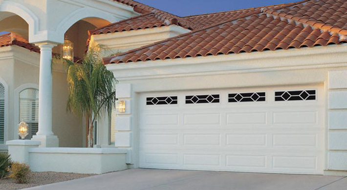 long panel garage door with decorative windows by amarr