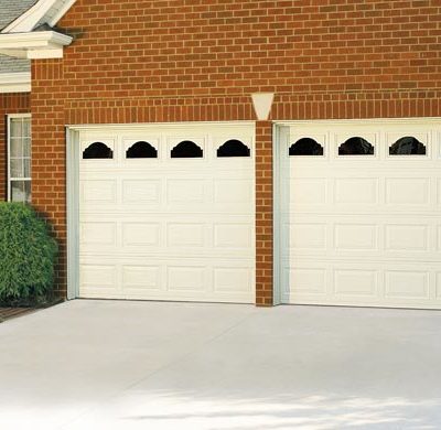 two one car garage doors with decorative windows by amarr