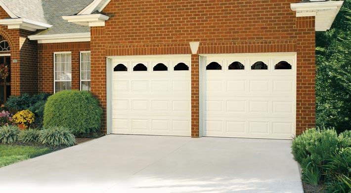 two one car garage doors with decorative windows by amarr