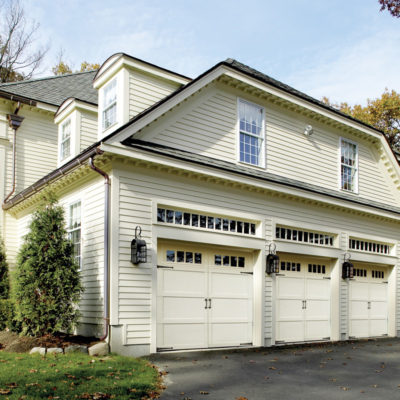 overhead doors impression fiberglass garage doors with white finish on two story house.