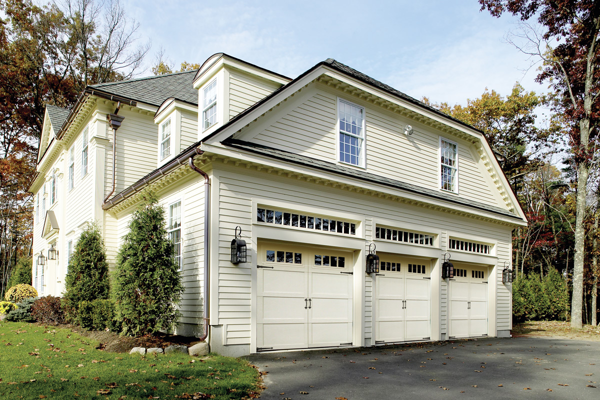 overhead doors impression fiberglass garage doors with white finish on two story house.