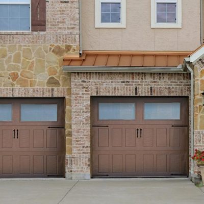 brown overhead impression steel garage doors with two large windows and large panels.