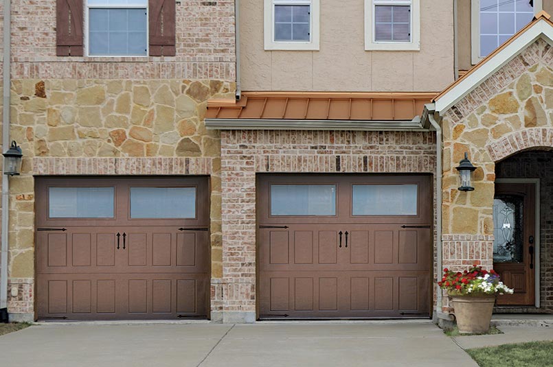 brown overhead impression steel garage doors with two large windows and large panels.