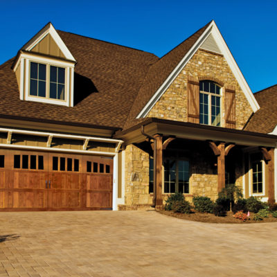 wide overhead signature carriage garage door with windows in top panel