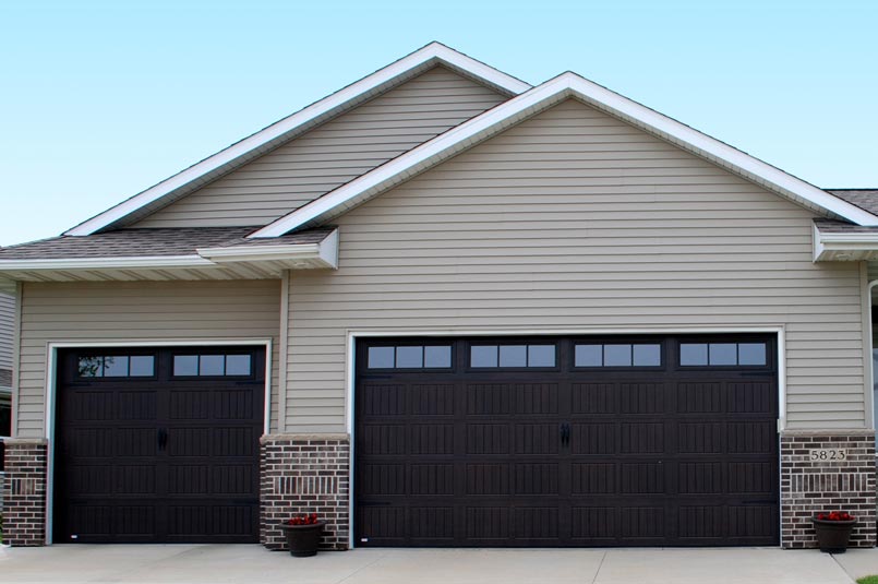overhead thermacore garage doors in dark finish with several windows.
