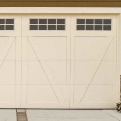 cream carriage house garage door with windows