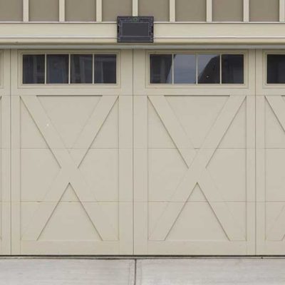 cream garage door with x's and windows