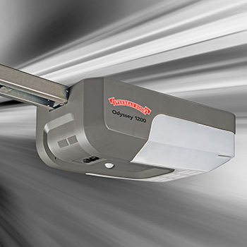 Photo overhead door odyssey 1200 ceiling mounted garage door opener on a gray background.