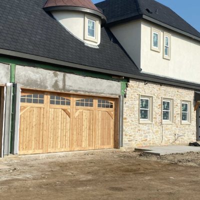 16x8 cedar garage door with glass and decorative braces