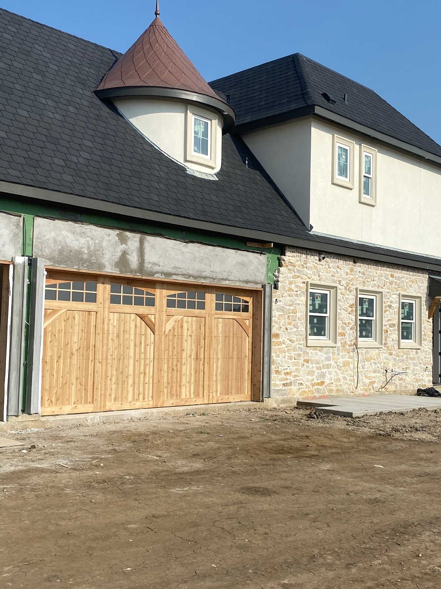 16x8 cedar garage door with glass and decorative braces