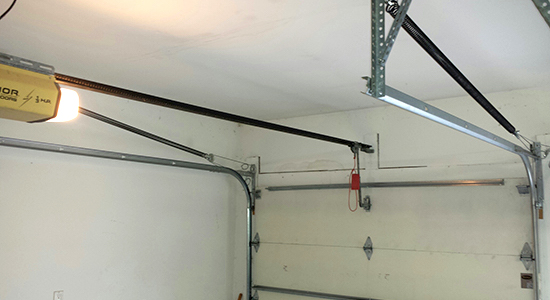 Photo of the interior of a garage with an extension spring system.