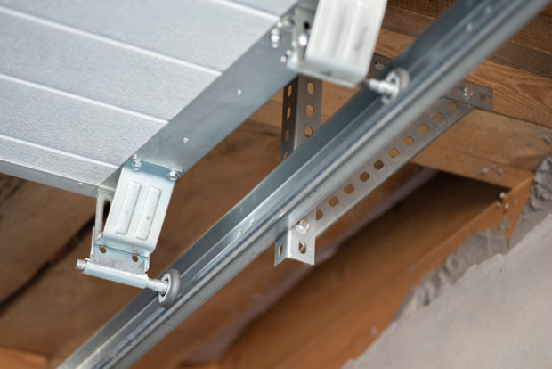garage door rollers coming out