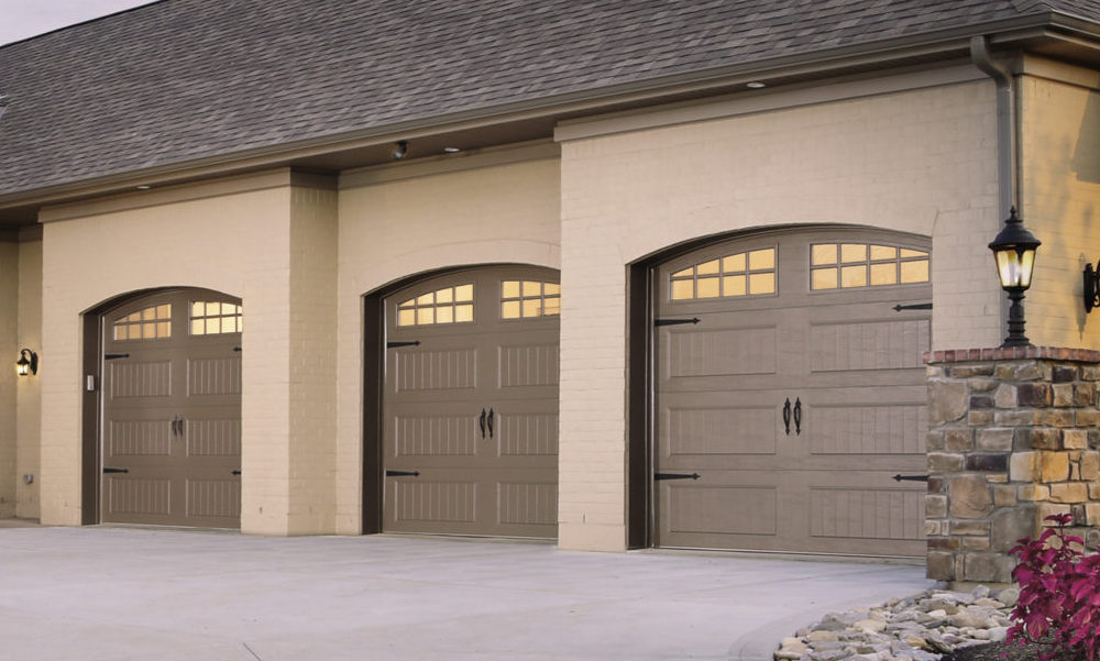 Arched carriage house garage doors on 3 car garage.